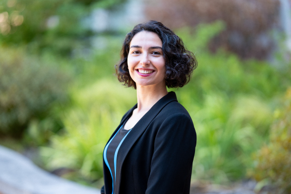 Photo of Zeynep Ceren smiling in a black jacket and black top