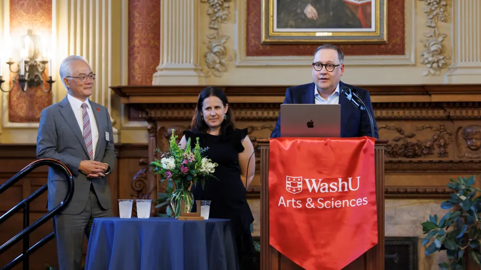 Photo of Dean Hu, Betsy Sinclair, and Chancellor Andrew Martin speaking to an audience