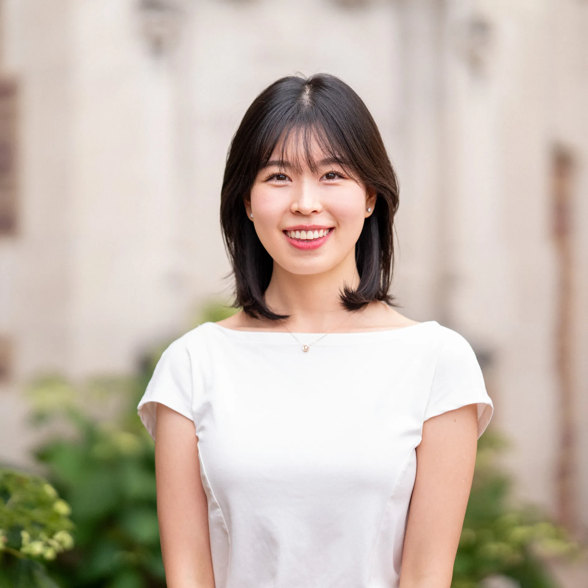Photo of Sein Park smiling in a white top